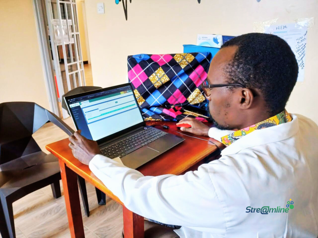 Dr. Nathan, the Medical Doctor checking on his queue of patients awaiting consultation